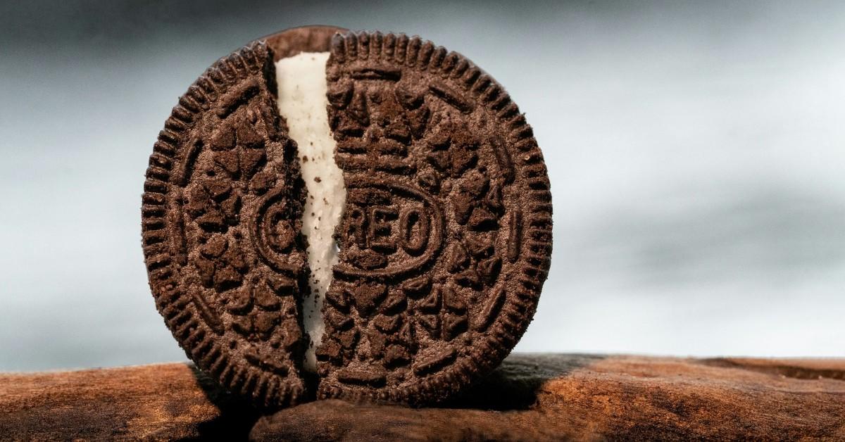 A closeup of a cracked Oreo cookie