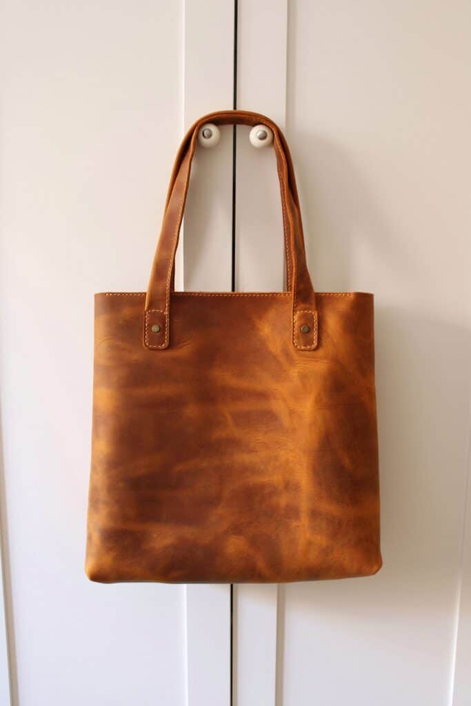 Brown vegan leather bag in a post about sustainable handbags.